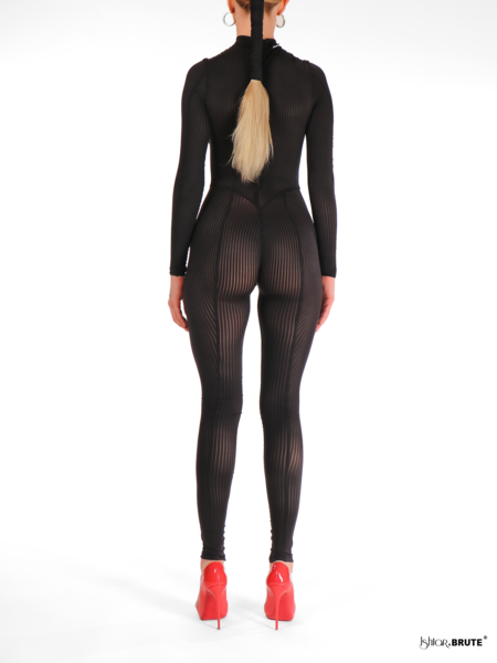 Back view of the Noemi Catsuit, featuring a zipper running from the neck to the back and signature seams that contour the legs like stockings.